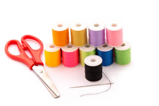 istock Multi-colored thread,Scissors, sewing needle, tape measure,thread picker clothing repair concept. 1153805716