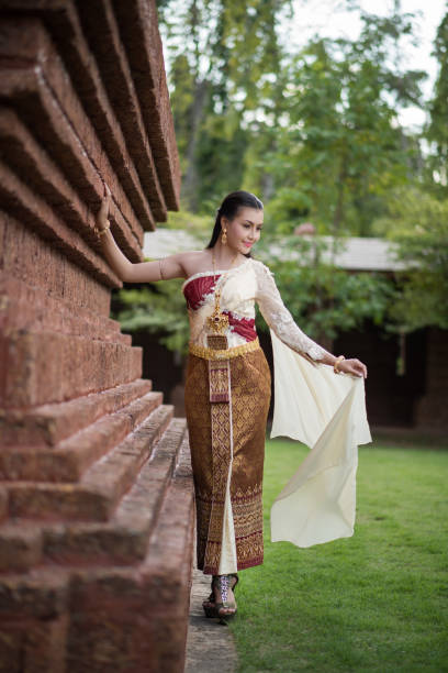 istock Beautiful Woman wearing typical Thai dress 1153806321