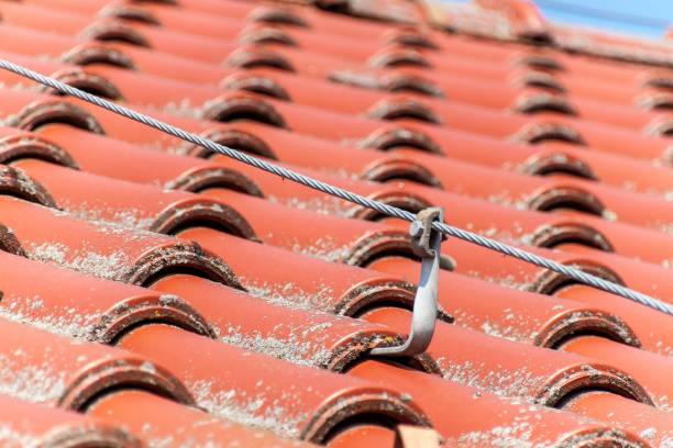 Detail of lightning rod on the roof of a house. Lightning Protection Components Detail of lightning rod on the roof of a house. Lightning Protection Components storm system stock pictures, royalty-free photos & images