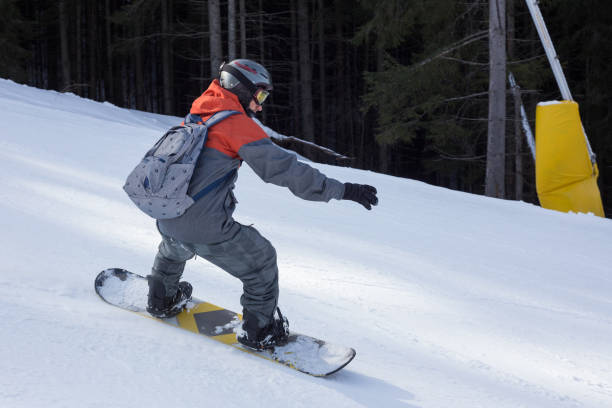 istock Snowboarder moves down the ski slope. 1153809066