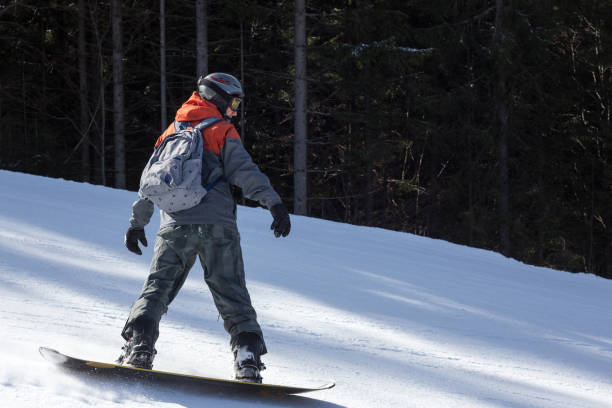 istock Snowboarder moves down the ski slope. 1153809096
