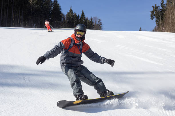 istock Snowboarder moves down the ski slope. 1153809104