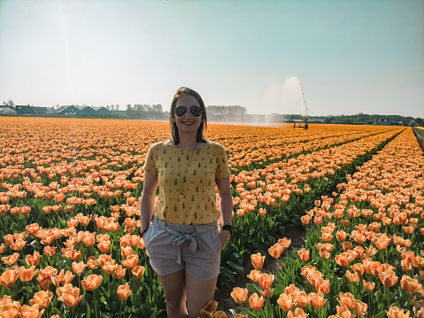 Woman between de flower fields in the Netherlands