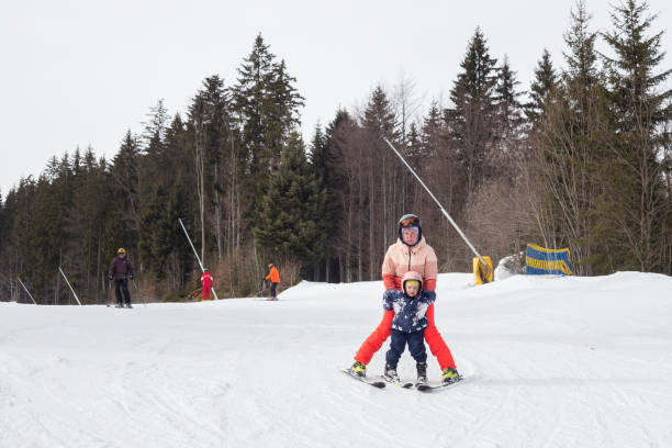 istock Mother teaches the child to ski. 1153810943