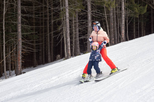 istock Mother teaches the child to ski. 1153810961