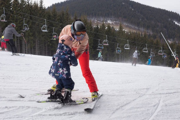 istock Mother teaches the child to ski. 1153810987