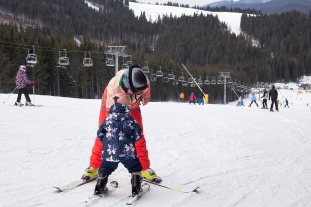 istock Mother teaches the child to ski. 1153811037