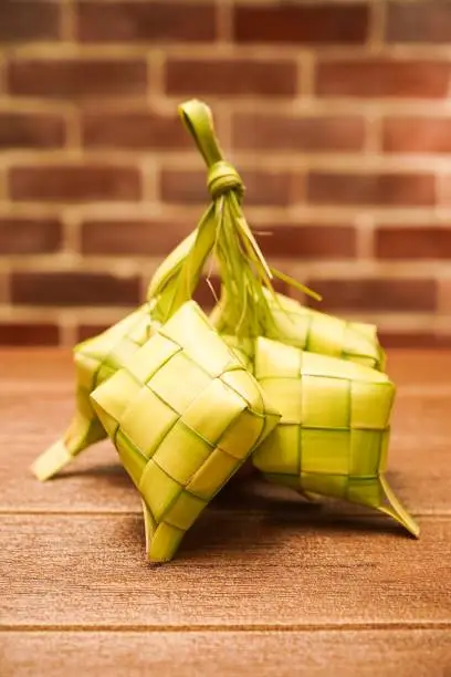 Ketupat, Kupat or Tipat is a type of dumpling made from rice packed inside a diamond-shaped container of woven palm leaf pouch, originating in Maritime Southeast Asia, specifically, what is today modern-day Indonesia. It is commonly found in Indonesia, Brunei, Malaysia, and Singapore. Typically served during eid or hari raya