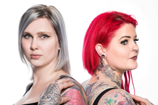 istock Two Beautiful Tattooed Women 1153815137