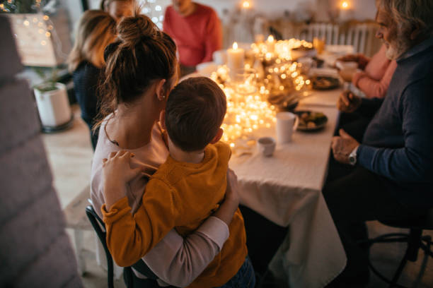 Kids during Christmas dinner with their family