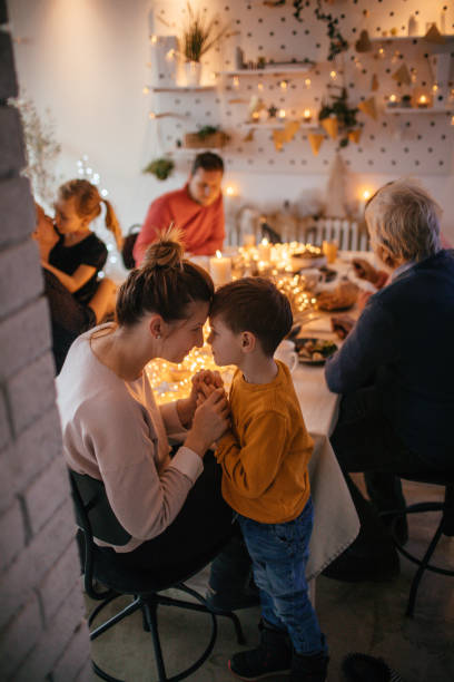 istock Kids during Christmas dinner with their family 1153816651