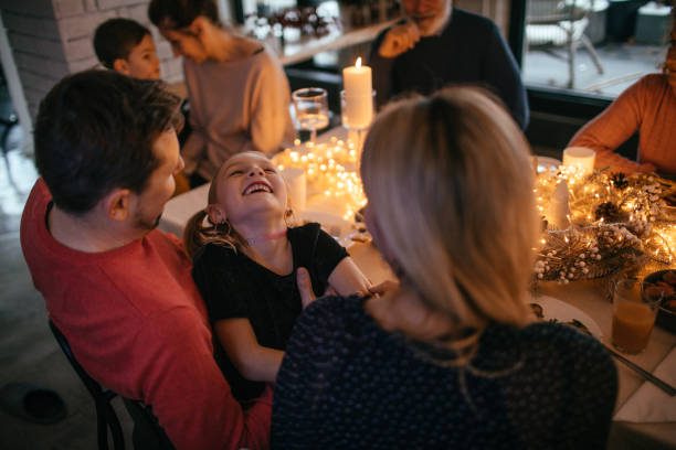 istock Kids during Christmas dinner with their family 1153816657