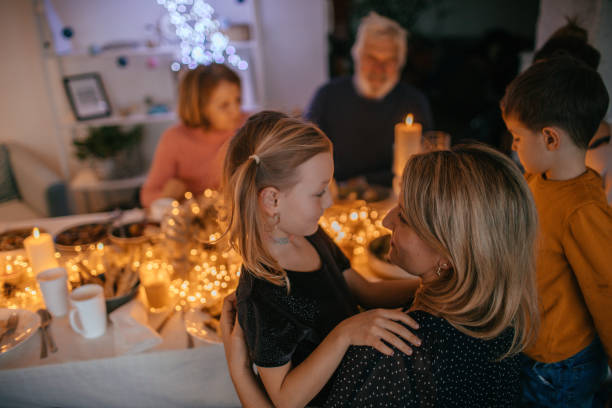 istock Kids during Christmas dinner with their family 1153817864