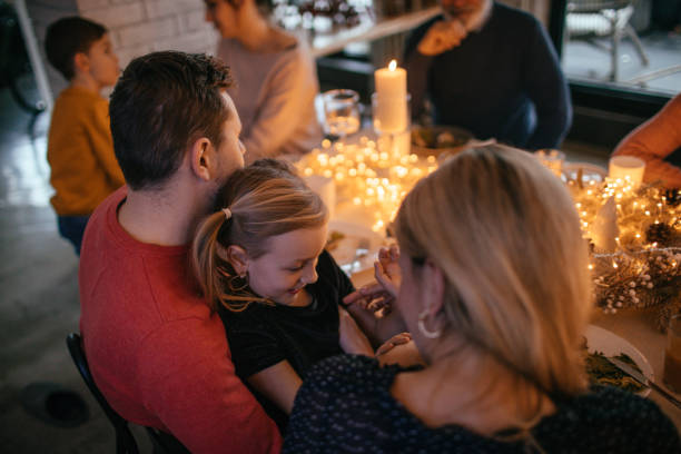 istock Kids during Christmas dinner with their family 1153817867
