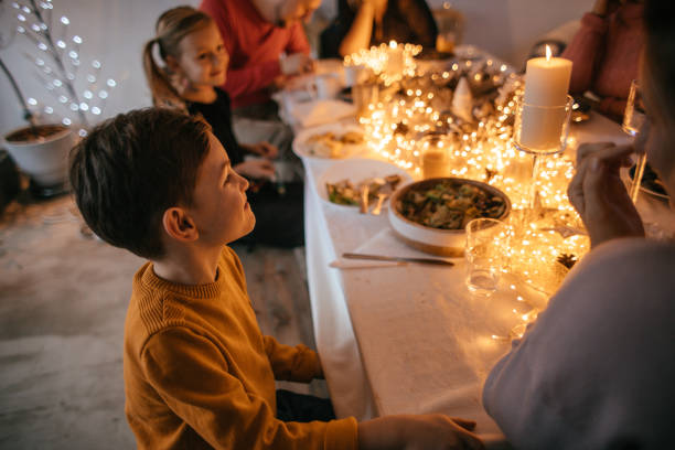 istock Kids during Christmas dinner with their family 1153818272