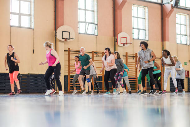 istock Group of people dancing at community dance class 1153818625