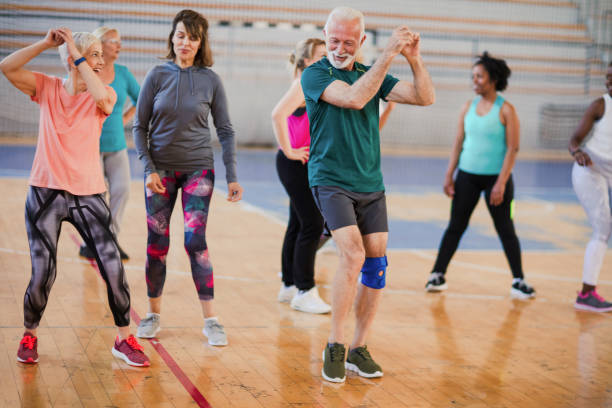 Energetic seniors people dancing at dance class Energetic seniors people dancing at dance class exercise class photos stock pictures, royalty-free photos & images