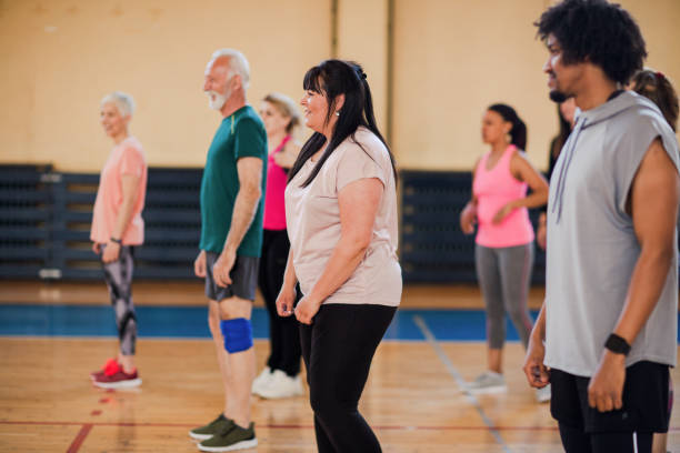 istock Dance instructor showing new moves to her dance class 1153818688