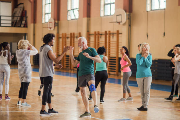 istock Smiling, enthusiastic people cheering in dance class 1153819044