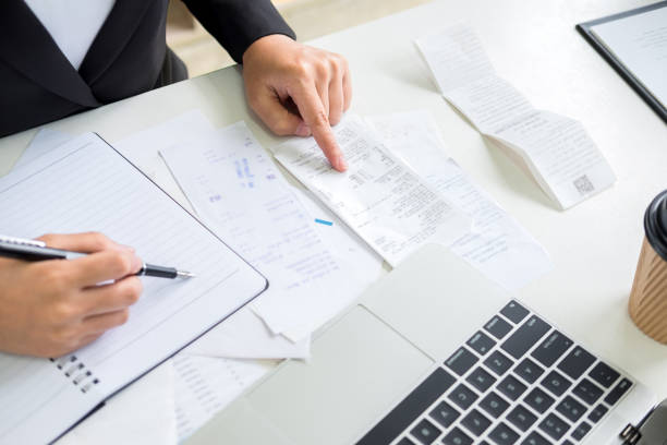 istock Midsection Of Businessman Calculating On Table 1153821967