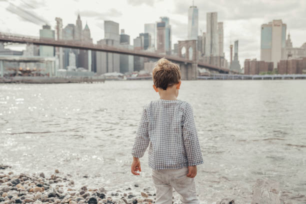 istock Boy playing in the Brooklyn Bridge Park, New York 1153824699