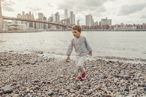 Boy playing in the Brooklyn Bridge Park, New York