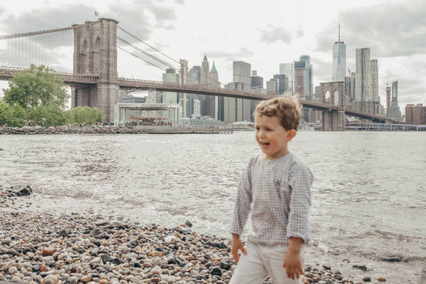istock Boy playing in the Brooklyn Bridge Park, New York 1153824710