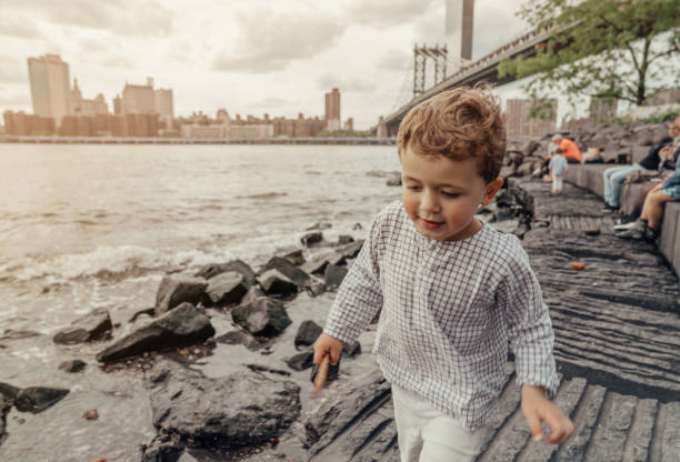 istock Boy playing in the Brooklyn Bridge Park, New York 1153824714