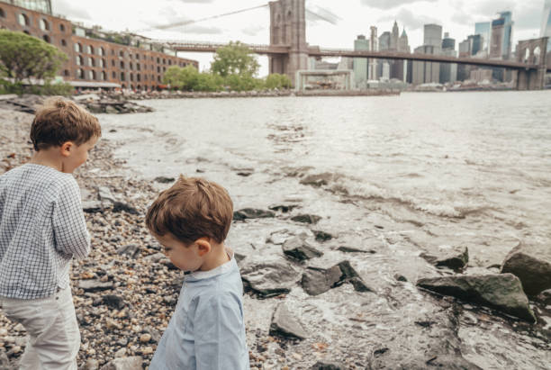 istock Boy playing in the Brooklyn Bridge Park, New York 1153824724