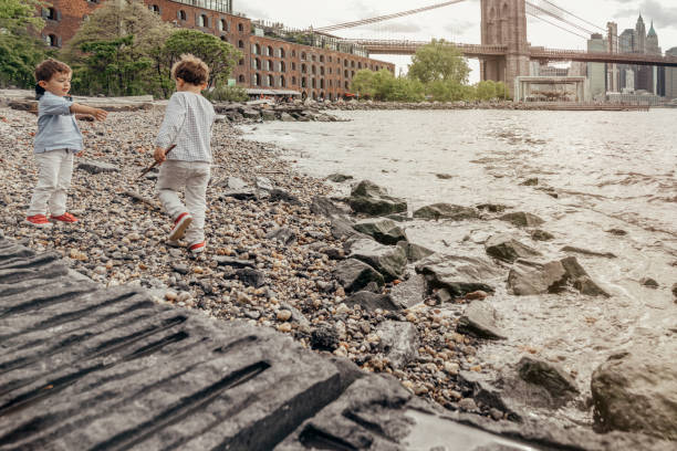 istock Boy playing in the Brooklyn Bridge Park, New York 1153824726