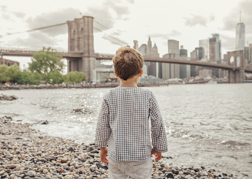 Boy playing in the Brooklyn Bridge Park, New York