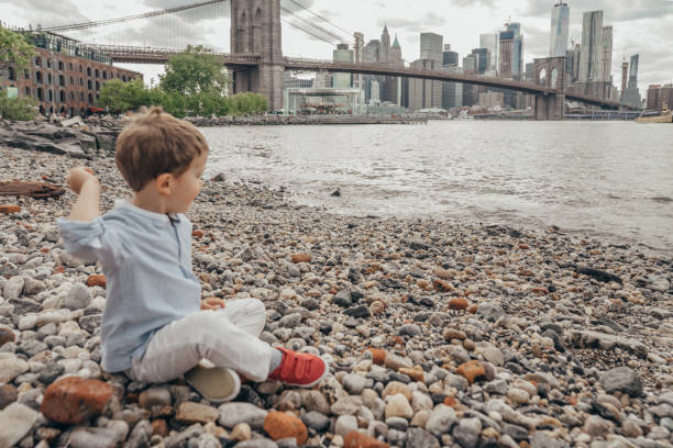 istock Boy playing in the Brooklyn Bridge Park, New York 1153824775
