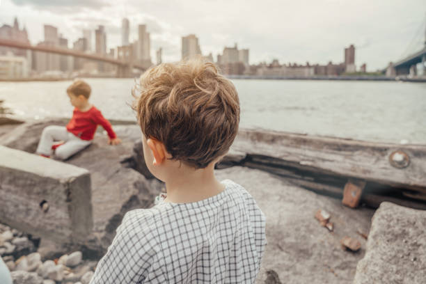 istock Boys playing in the Brooklyn Bridge Park, New York 1153825309
