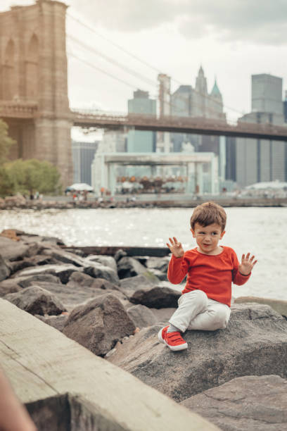 istock Boy playing in the Brooklyn Bridge Park, New York 1153825351