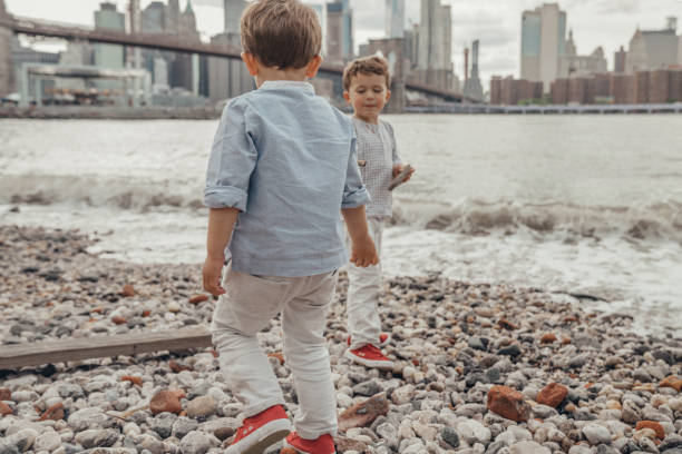 istock Boy playing in the Brooklyn Bridge Park, New York 1153825369