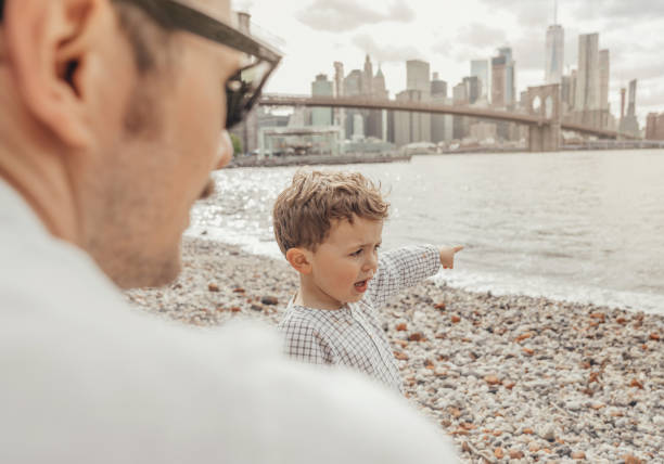 istock Boy playing in the Brooklyn Bridge Park, New York 1153825409