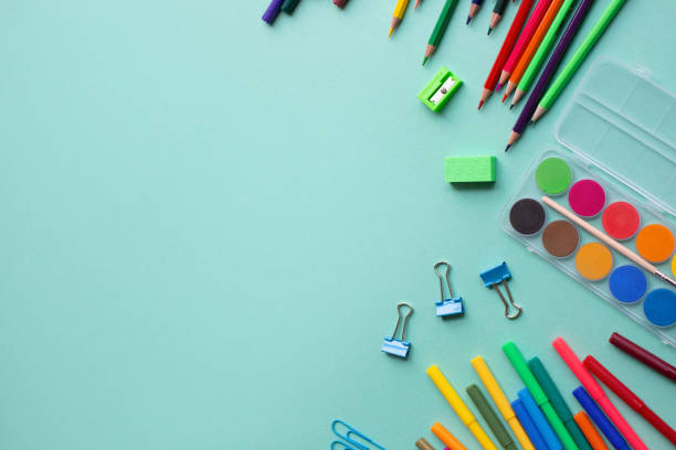 istock Concept back to school. School supplies on color background. Copy space 1153825572