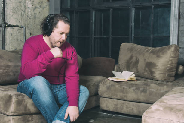 istock Funny fat man resting at home 1153828039