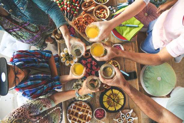 istock High Angle View Of People Toasting Drinks Over Table At Restaurant 1153828537