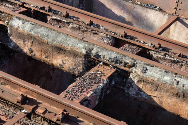 istock Elevated train tracks in disrepair, crumbling concrete and rust patina 1153831093