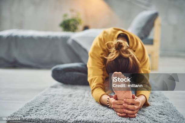 Woman Doing Yoga In Bedroom Stock Photo - Download Image Now - Yoga, Domestic Life, Women