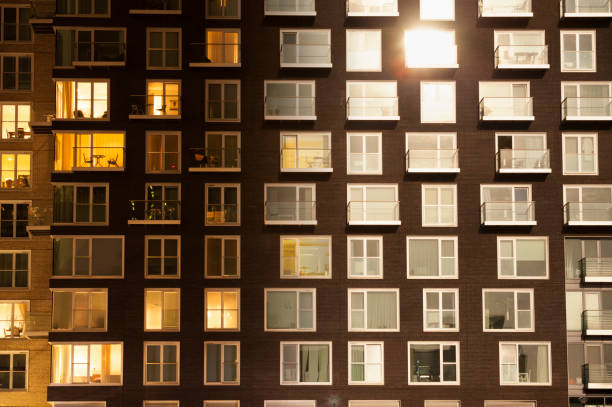 istock Day to night an apartment block 1153838500