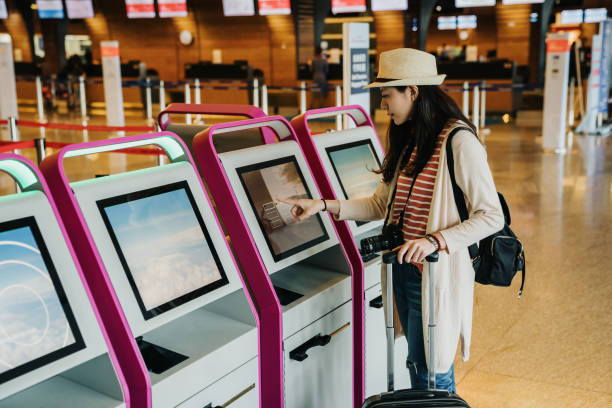 woman in international airport do self check-in - entering airplane imagens e fotografias de stock