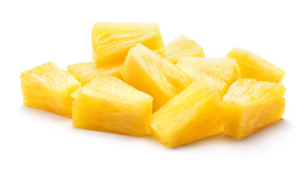 istock Canned pineapple chunks. Pineapple slices isolated. Pineapple pieces on white background. 1153839372