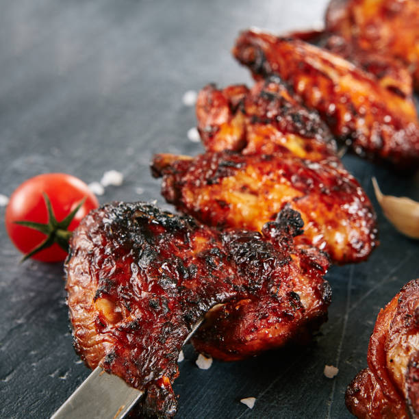 istock Deep Roasted Spicy Buffalo Chicken Wings on a Skewer 1153839549