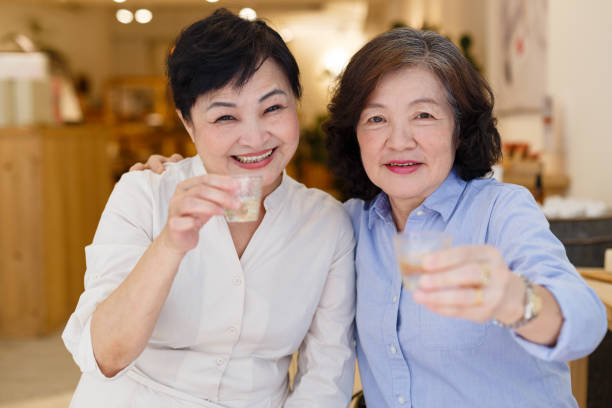 istock 2 senior women get together having fun 1153839935