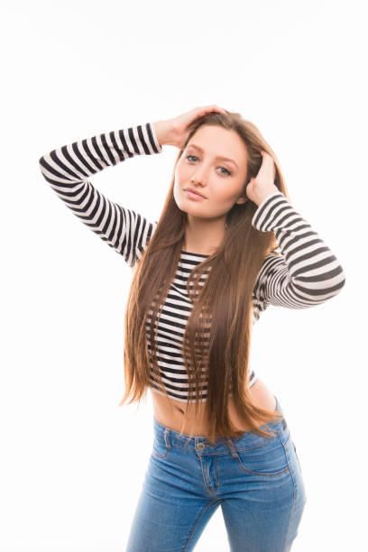 istock Pretty girl in striped blouse posing on white background 1153843053