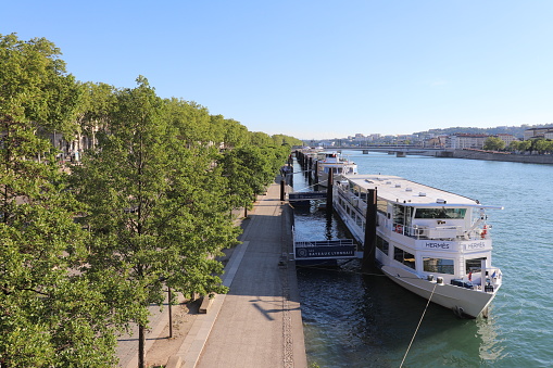 Lyon city - River cruise ships moored at Claude Bernard quay on the Rhone river