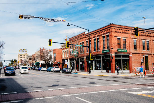 Looking across towards the red bricked Schnee's Outdoor Shop at the intersection of West Main Street and North Black Avenue in the town of Bozeman, Montana, USA.
