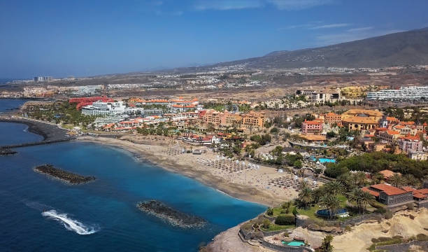 aerial panorama of costa adeje resort and playa del duque beach, tenerife, canary islands, spain. - playa de las américas imagens e fotografias de stock